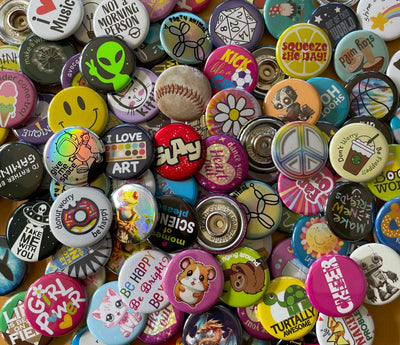 A pile of colorful ChattySnaps snap-on buttons